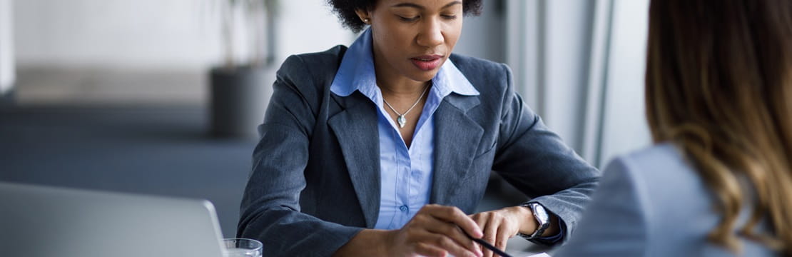 A client and her financial advisor reviewing potential methods to rebalance her portfolio 